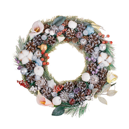 Christmas beautiful decorated fir branch, Christmas wreath, decorations for holiday isolated on white background close-upの写真素材