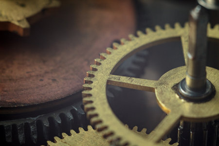 Macro close-up of the gear mechanism: detailed teeth of metal gears, shiny surfaces, complex...