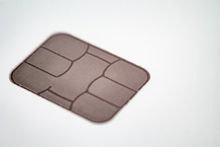 Close-up of a bank card chip demonstrating contactless payment capabilities.の写真素材