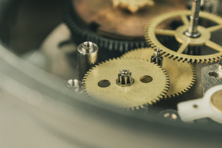 Close-up of a mechanical mechanism with gears, symbolizing watch repair and complex micromechanics.の写真素材