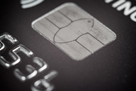 Close-up of a bank card chip demonstrating contactless payment capabilities.