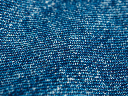 Close-up of denim highlighting texture and detail. An excellent choice for fashion and textile...