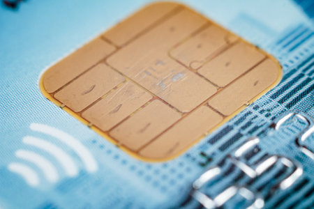 Close-up of a bank card chip demonstrating contactless payment capabilities.