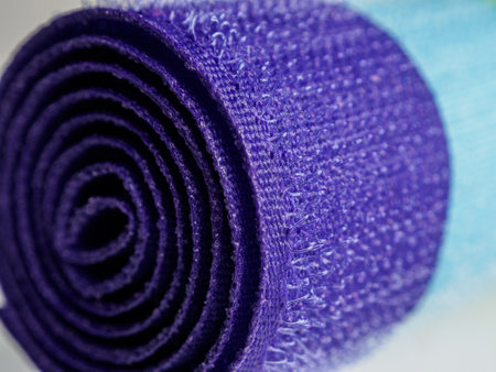 Close-up of a rolled yoga mat: textured surface, ideal for easy attachment and adjustment.の写真素材
