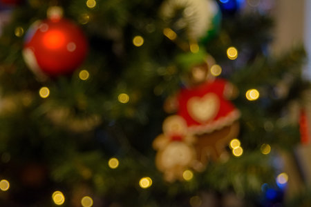 A New Year's garland with rich lights on a dark bokeh background creates a warm and mysterious atmosphere of a magical holiday.の写真素材