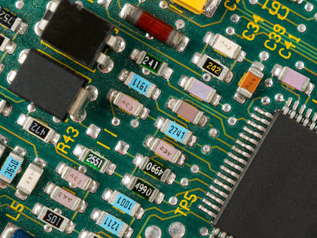 Close-up of microcircuits and components: chips, diodes and capacitors on a printed circuit board,...
