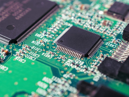 Close-up of ICs, chips, diodes and capacitors on a printed circuit board showing electronic component parts.の写真素材