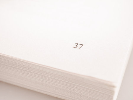 Close-up of a book page capturing text. Ideal image for literature, reading and education themes.の写真素材