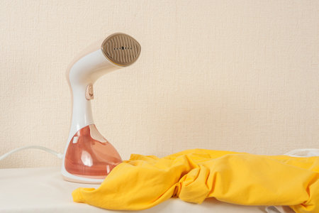 A clothes steamer, creating comfort and order.の写真素材