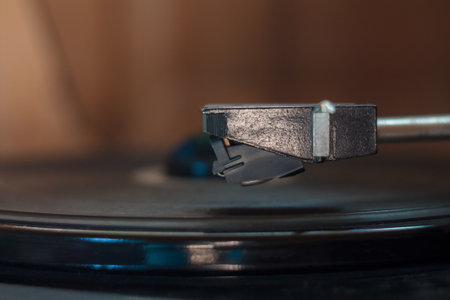 Vintage music player with vinyl and radio creates a retro atmosphere, immersing you in the world of ancient music.の写真素材