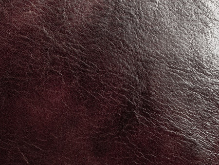 Textured leather macro background showing elegant lines and shades, ideal for stylish and luxurious designs.の写真素材