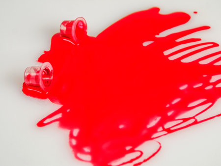 Close-up of bright red tattoo ink in a jar, highlighting color saturation and quality to create unique works.の写真素材