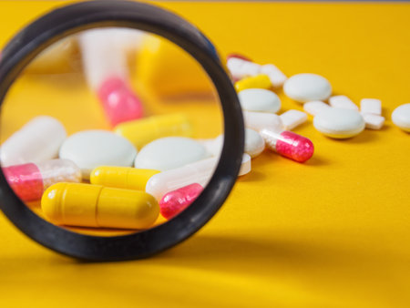 Pills of different shapes and colors on a spectacular background: Pharmaceuticals and the importance of medicines for health, close-up.の写真素材