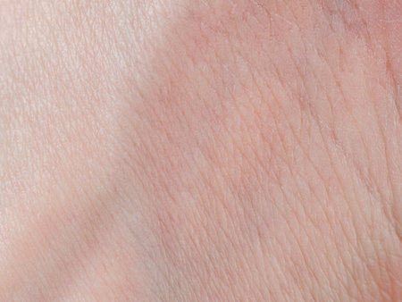 Photograph of human skin showing texture, shades and nature, emphasizing uniqueness and elasticity, close-up.の写真素材