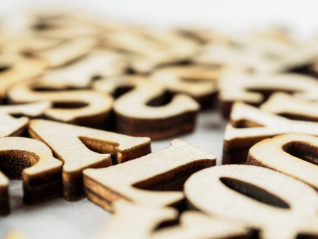 Letters of the English alphabet on a background with selective focus, creating a sense of depth and emphasis on language learning, close-up.の写真素材