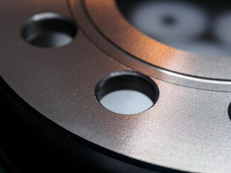 Close-up detail of a metal brake disc, showing intricate patterns and textures. Industrial, metallic, and mechanical.の写真素材