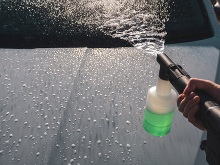 Manual Car Wash Using High Pressure Equipment To Effectively Remove Dirt And Protect The Coating, Close-Up.の写真素材