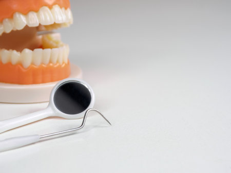 Dental tools for examination. Probes, mirrors, picks; close-up on instruments used for oral health diagnosis, close up.の写真素材