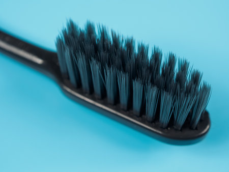 A toothbrush with soft bristles, ideal for gentle care of teeth and gums, ensuring oral health, close-up.の写真素材