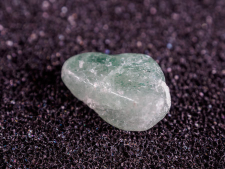 Green quartz is a variety of quartz exhibiting a green hue, often due to trace amounts of minerals included. It is sometimes referred to as Prasiolite when heat-treated.の写真素材