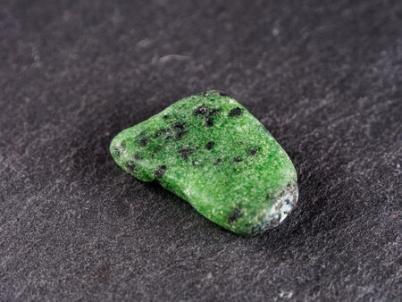 Zoisite is a silicate mineral that occurs in a variety of colors, including green, blue, pink, and violet, and is sometimes used as a gemstone.の写真素材