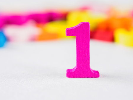 Bright close-up of the number one. Sharp focus, vibrant color. Perfect for winning, achievement, ranking themes.の写真素材