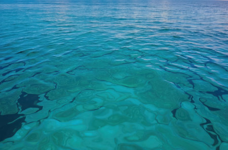 Blue water top view. Surface texture, vibrant color, liquid abstract.の素材