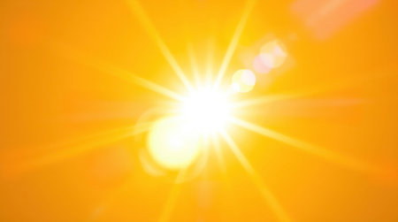 Bright lens flare with vibrant colors. Light streaks and balanced tones create a striking abstract background.の素材