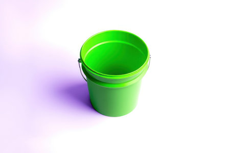 Green bucket on white. Simple clean, isolated object, bright lighting.の素材