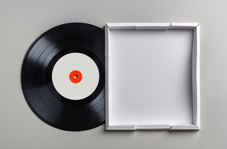 A blank, black vinyl record ready for audio recording, close up.の素材