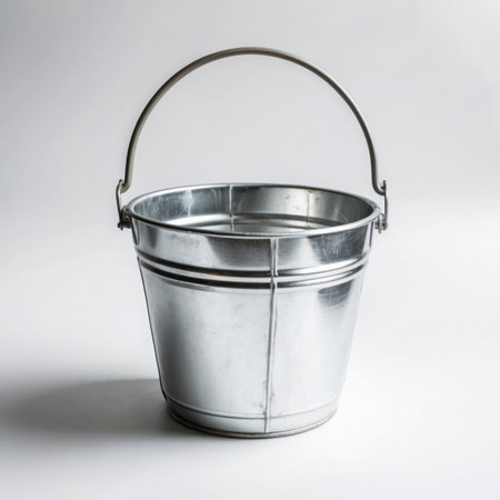 A single zinced bucket isolated on a clean background, showing its metallic texture and simple shape.の素材