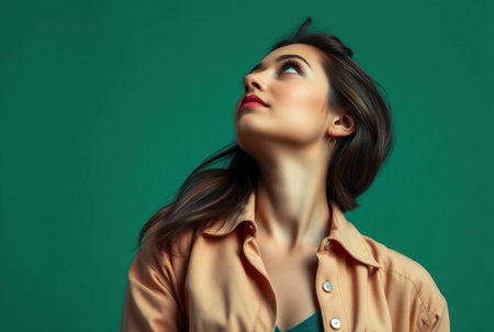 A beautiful woman looking upwards with a serene expression.の素材