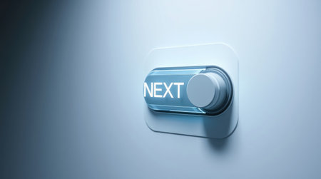 A single illuminated button on a blue wall, representing progression and digital advancement.の素材