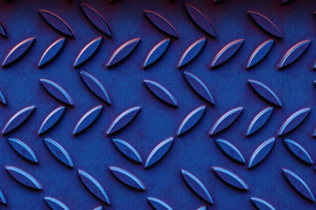 Close-up image of a blue metal plate with circular patterns exhibiting reflection and light.の素材