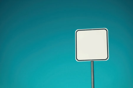 A white speed limit sign displaying the number on a blue background.の素材