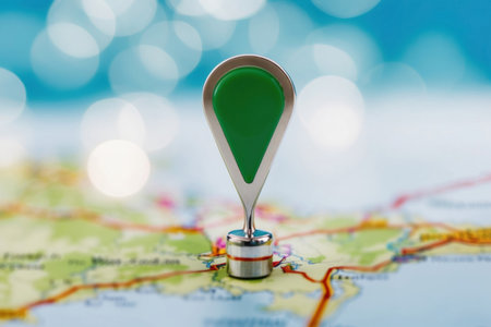 Location revealed. Close-up of a map marker with bokeh creating a sense of mystery and exploration.の素材