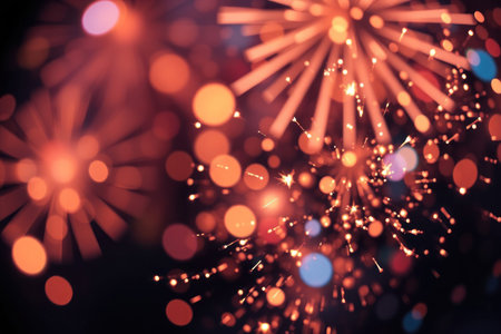 A vibrant and blurred photograph of fireworks illuminating the night sky.の素材