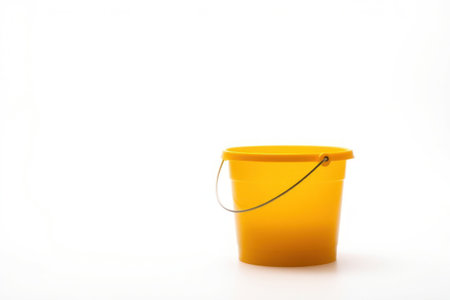 A vibrant yellow plastic bucket sits alone on a white background.の素材