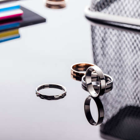 Group of beautiful jewelry rings on a table with reflection and with a fashionable background