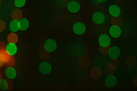 multicolored christmas garlands in blurの写真素材