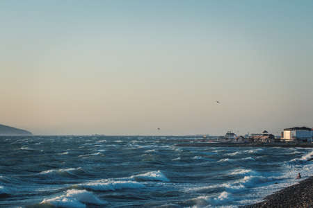 storm on the black sea, at dawn, view from the stone beachの写真素材