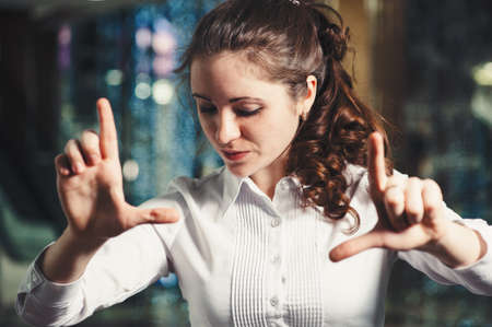 Business woman gesturing with hands in office close-up. Classic business. 
Interactive touch panel.の写真素材