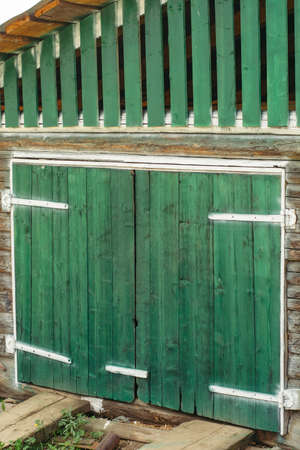 Green wooden gate. Textured wooden doors. Pattern. Mock up.の写真素材
