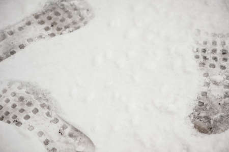 Interesting interpretation "Walking in a circle, hopeless situation in life" with the help of a footprint of shoes in the snow.の写真素材