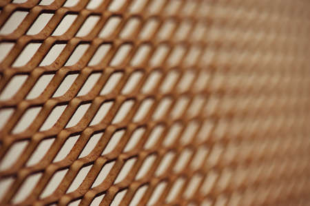 Old rusty mesh in blurring. Colorful pattern. Metal rusty fences.
