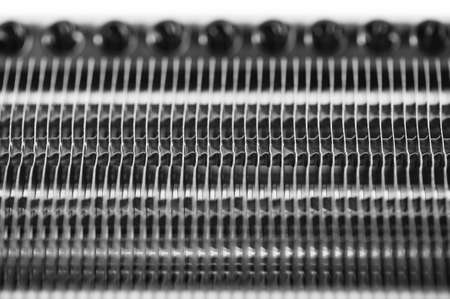 Part of the radiator for cooling the engine close-up. Steel texture.