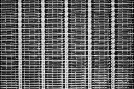 Vertical stripes of a textured metal surface.の写真素材