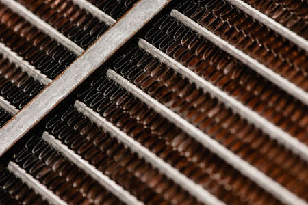 Old, rusty automotive cooler. Rusty, red lattice texture. Grid.の写真素材