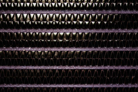 Old, rusty automotive cooler. Rusty, red lattice texture. Grid.の写真素材