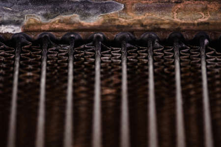 Old, rusty automotive cooler. Rusty, red lattice texture. Grid.の写真素材